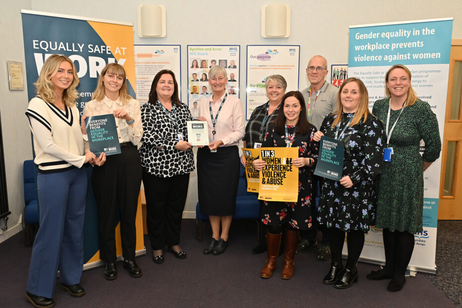 Representatives from NHS Ayrshire & Arran pictured receiving the Equally safe at work accreditation from Close the Gap.