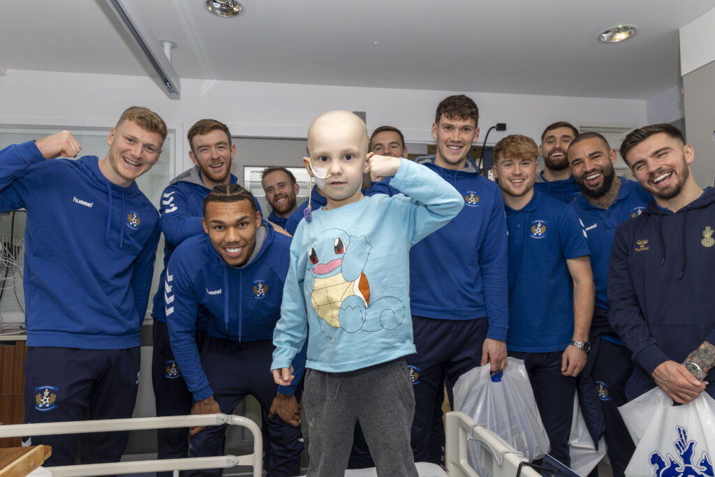 Players from Kilmarnock Football Club visiting the children's ward