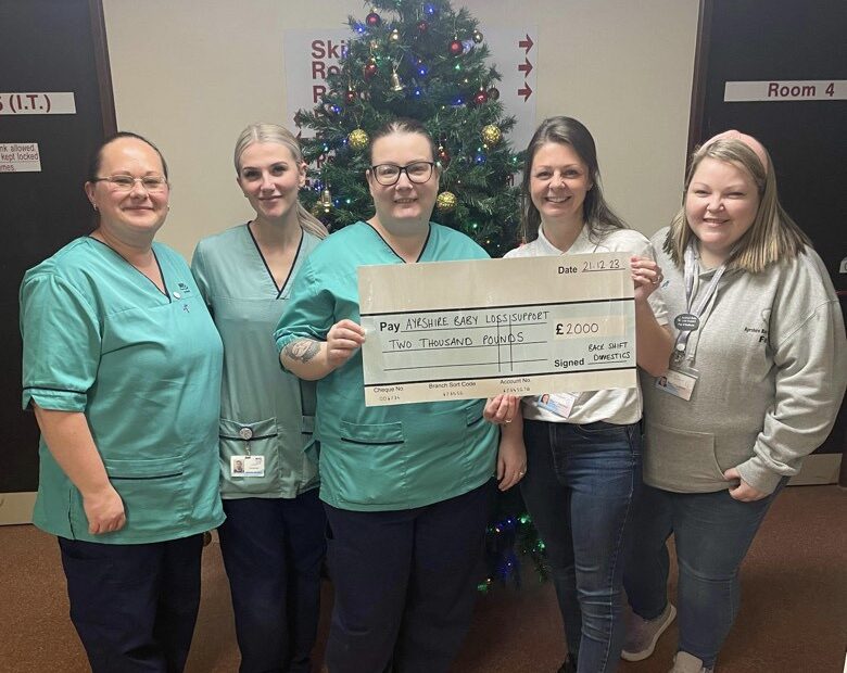 Staff from Domestic services at University Hospital Ayr presenting a cheque to the Babyloss charity