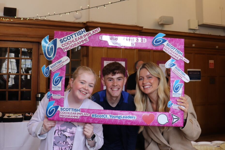 Kara Gillespie, William Palmer and Tasha Ghouri in front of a selfie board
