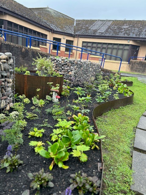 The raised pebble garden beds at Kyle unit garden at Ailsa.
