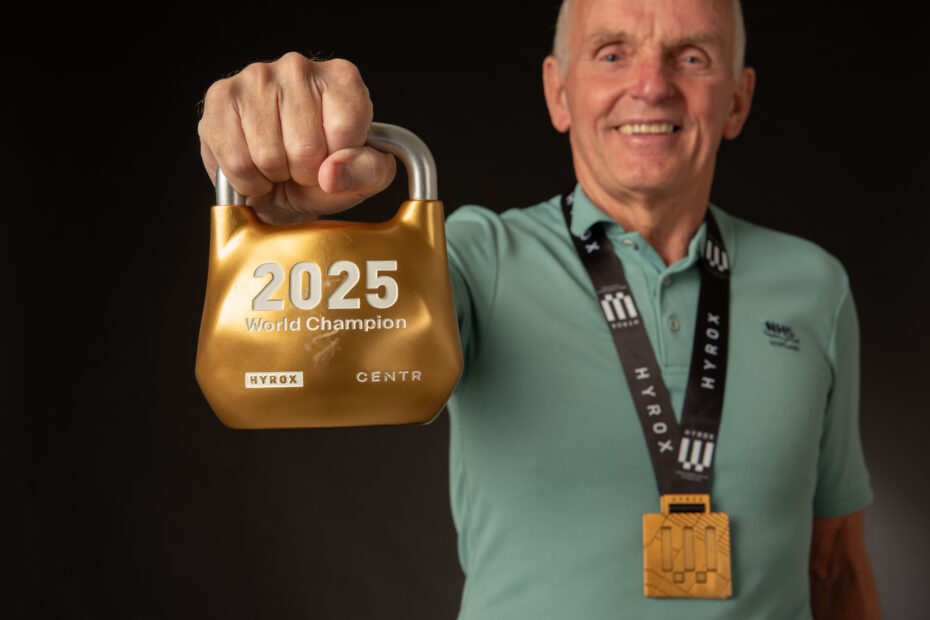 David standing holding his award for Hyrox 2025