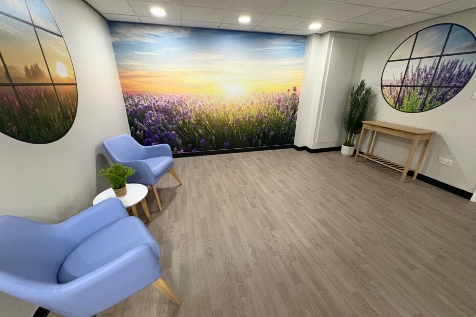 Newly designed and refurbished viewing room at University Hospital Crosshouse with wooden floors, scenic pictures and mural on the back wall.