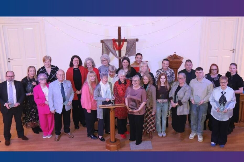 Volunteer award winners in group on stage