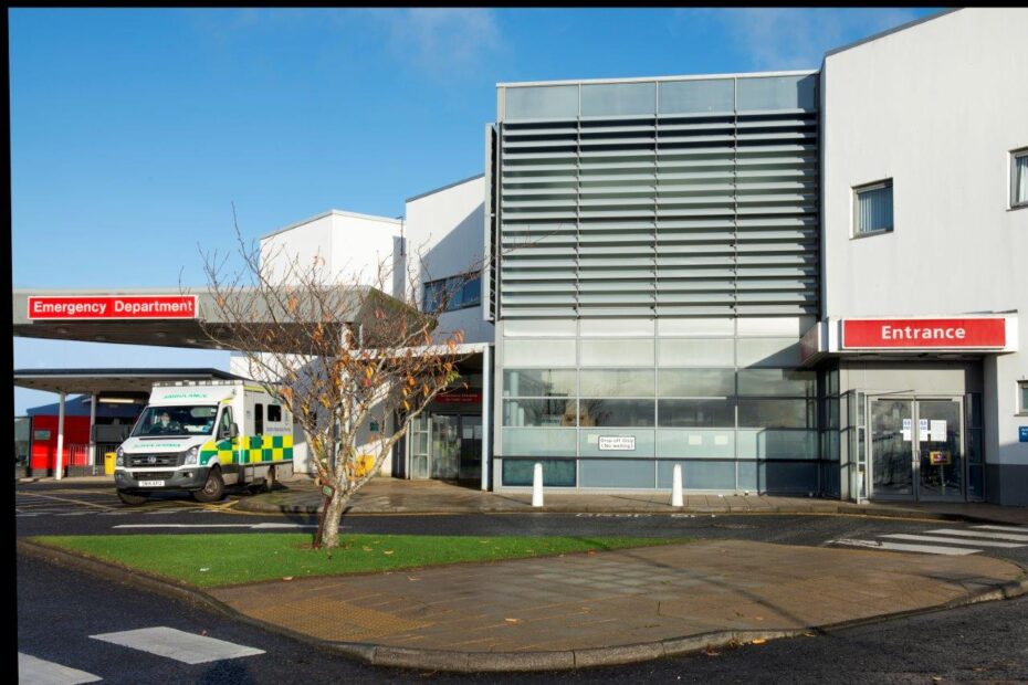 Picture of the front of University Hospital Crosshouse Emergency department with Scottish Ambulance vehicle sitting outside