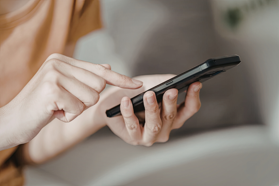 Image of a person's hands holding a smartphone