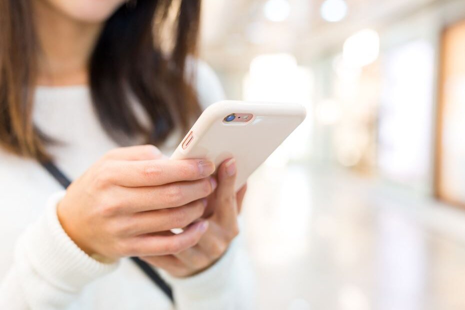 Image of a person holding a smart phone.